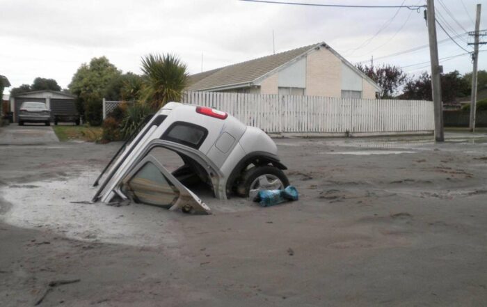 Sinking cars in Christchurch caused by Soil liquefaction