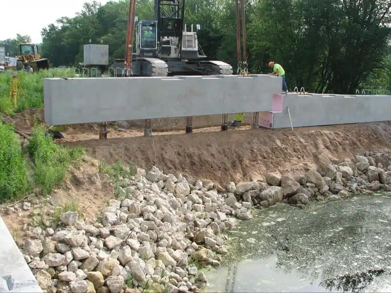 Image of precast concrete piles for onsite bridge construction (Source)